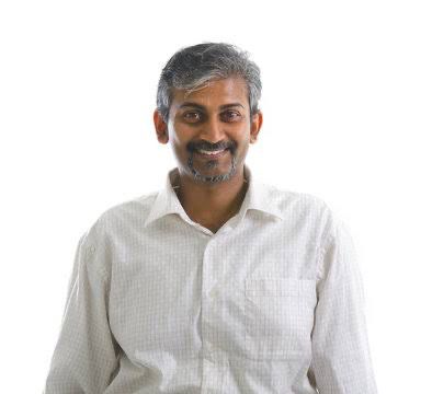 Manish Arora, Trauma & PTSD Specialist at NuroSpark — professional headshot in clinical setting